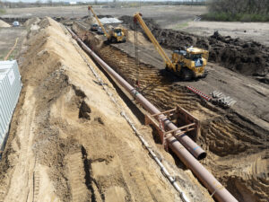 Assessing breakover of pipe for a safe tie-in following measurement with current trench box considerations. Assessment of equipment positioning, bell hole integrity and travel lane conditions.