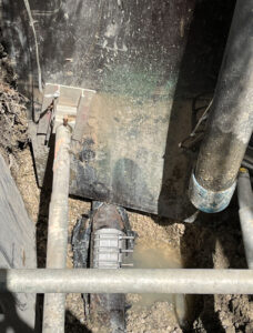 Conduit connection in trench box